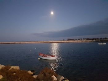 Scenic view of sea against sky at night