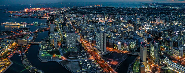High angle view of illuminated modern buildings in city