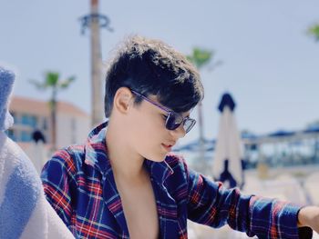 Close-up of young woman looking away