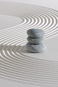 Japanese zen garden with stone in textured sand