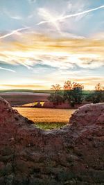 Scenic view of landscape against cloudy sky