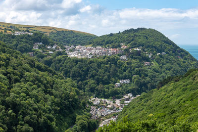 High angle view of trees and mountains against sky