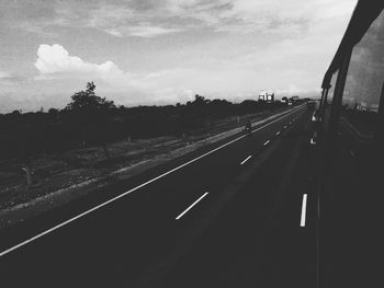 Cars on road against sky