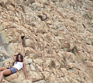 Woman standing on rock