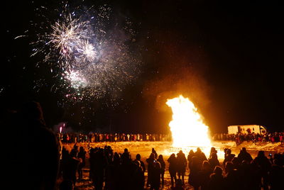 Low angle view of firework display at night