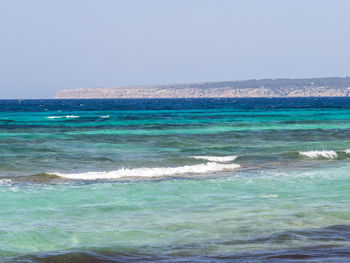 Scenic view of sea against clear sky