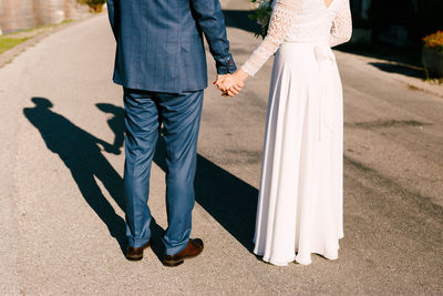 Low section of couple standing on floor