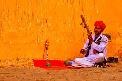 Full length of a man playing outdoors