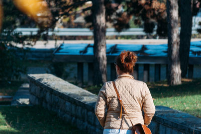 Woman walking on footpath