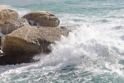 Waves splashing on rocks