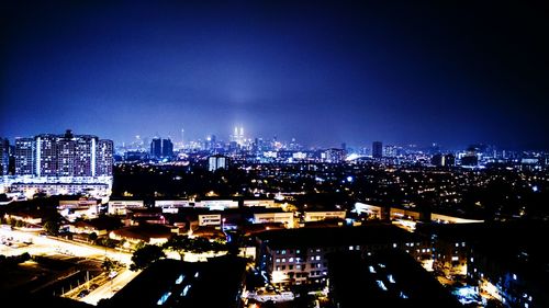 Illuminated cityscape at night