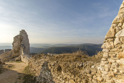 Rock formations on landscape against sky