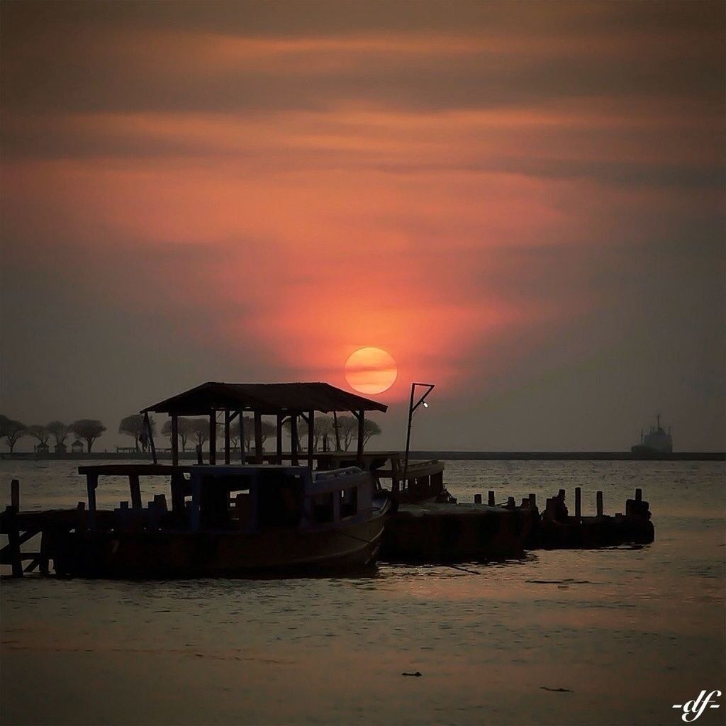 sunset, sea, water, nautical vessel, transportation, boat, sky, mode of transport, scenics, beauty in nature, orange color, tranquil scene, horizon over water, beach, tranquility, silhouette, nature, idyllic, cloud - sky, shore