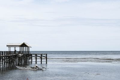 Pier over sea against sky