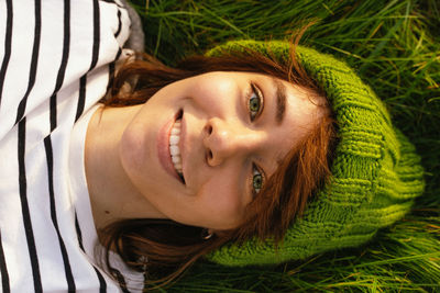 Close-up of woman lying down on grass