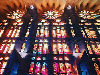 Low angle view of illuminated chandelier in building