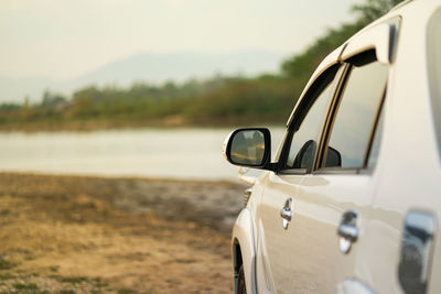 Close-up of vintage car on road