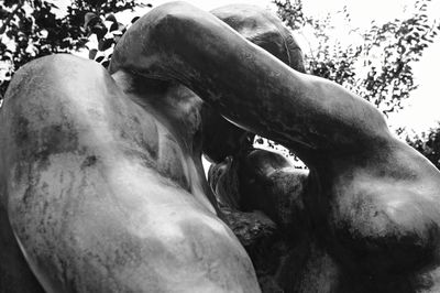 Low angle view of statue against trees