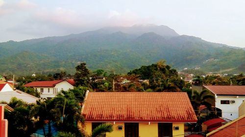 Houses against mountains