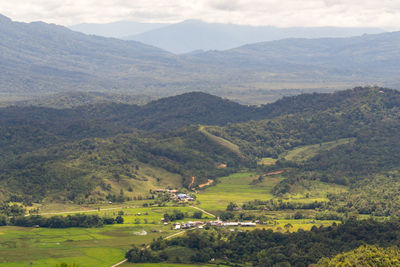 High angle view of agricultural field against mountains