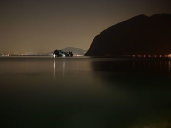 Scenic view of sea against sky at night