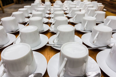 High angle view of coffee cups on table