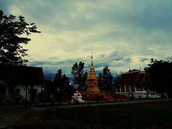 View of temple building against cloudy sky