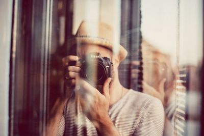 Midsection of man photographing