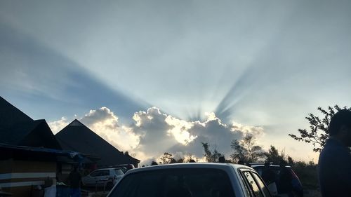 Cars on road against sky