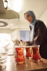 Woman preparing evening tea at home