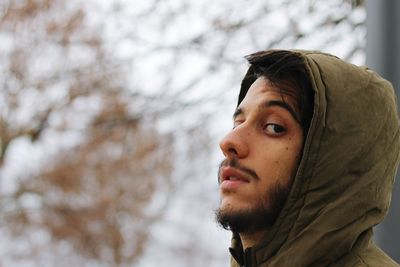 Portrait of young man looking away