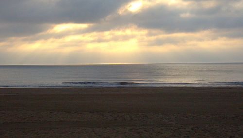 Scenic view of beach at sunset