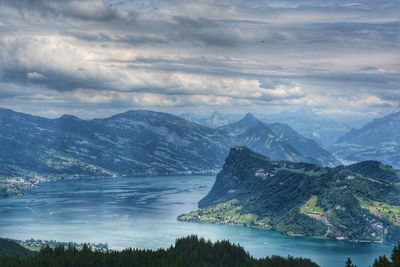 Scenic view of lake and mountains against sky