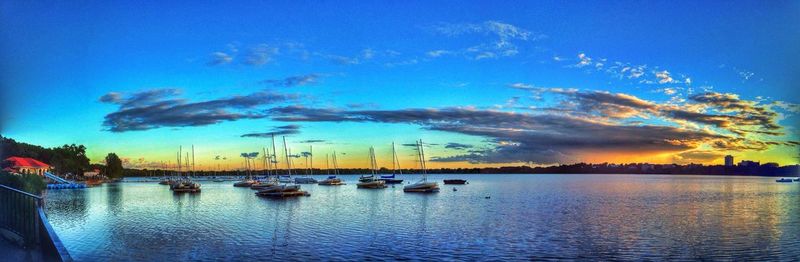 Scenic view of lake against sky at sunset