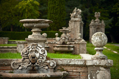 Buddha statue against stone wall