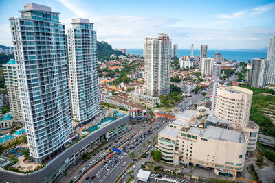 High angle view of buildings in city against sky