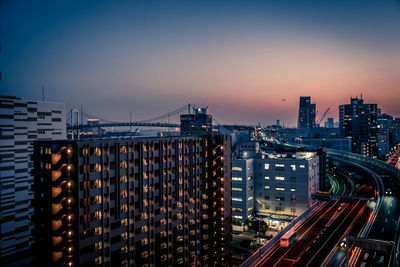 High angle view of illuminated buildings in city at night