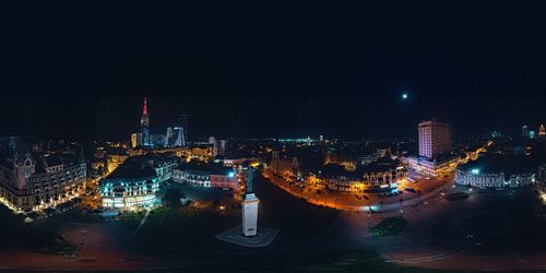 High angle view of illuminated buildings in city at night