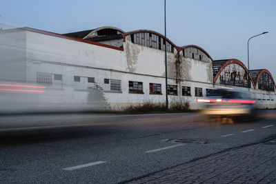 Blurred motion of cars on road in city