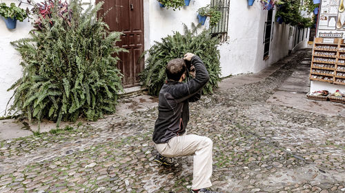 Full length of man standing by tree