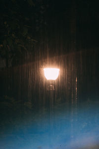 Reflection of illuminated lights in water at night