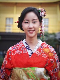 Close-up portrait of smiling young woman