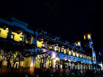 Illuminated buildings in city at night