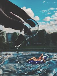 Man surfing in swimming pool