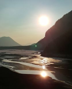 Scenic view of beach against sky during sunset