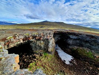 Scenic view of landscape against sky surtshellir