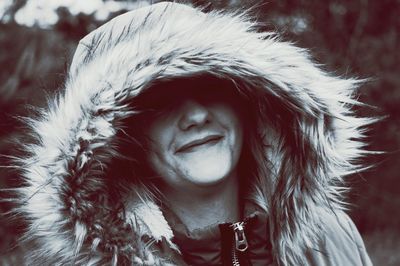 Close-up portrait of woman wearing fur coat