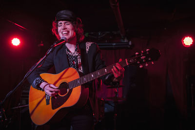 Guitarist performing at a nightclub