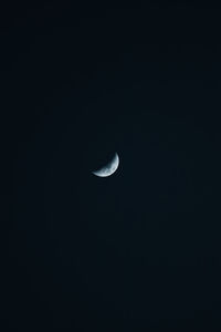 Low angle view of moon against sky at night