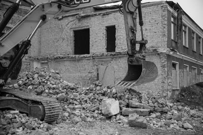 Abandoned building by construction site